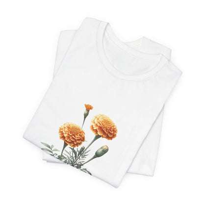 A t-shirt featuring a beautiful marigold for October. Perfect for October birthdays and floral art lovers. Comfortable and stylish for casual outings or celebrations. Bella+Canvas 3001 t-shirt in white. ReadyShirtAim.com