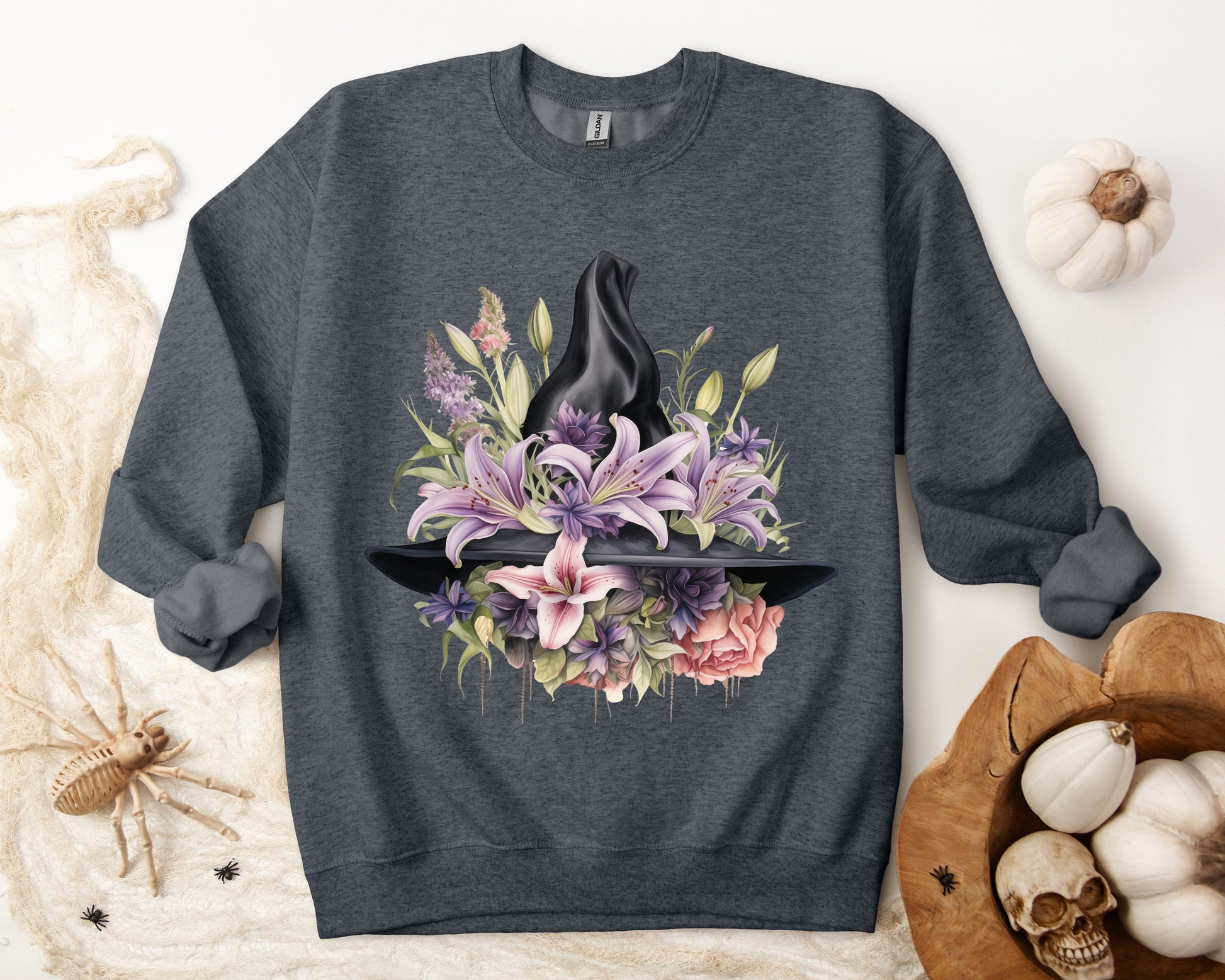 Mystical Floral Witch Hat Sweatshirt featuring a watercolor illustration of a black witch hat with flowers in purple, pink, and green. Available in multiple dark and light colors and sizes. Gildan 18000 sweatshirt in Dark Grey Heather. ReadyShirtAim.com