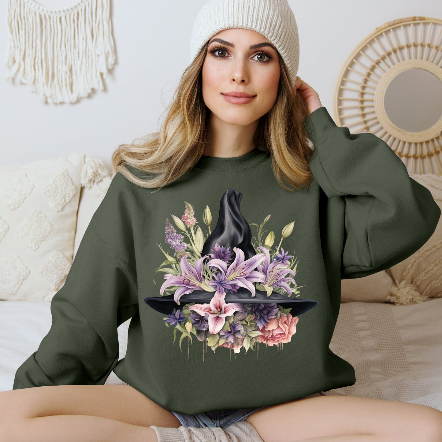 Mystical Floral Witch Hat Sweatshirt featuring a watercolor illustration of a black witch hat with flowers in purple, pink, and green. Available in multiple dark and light colors and sizes. Gildan 18000 sweatshirt in Military Green. ReadyShirtAim.com