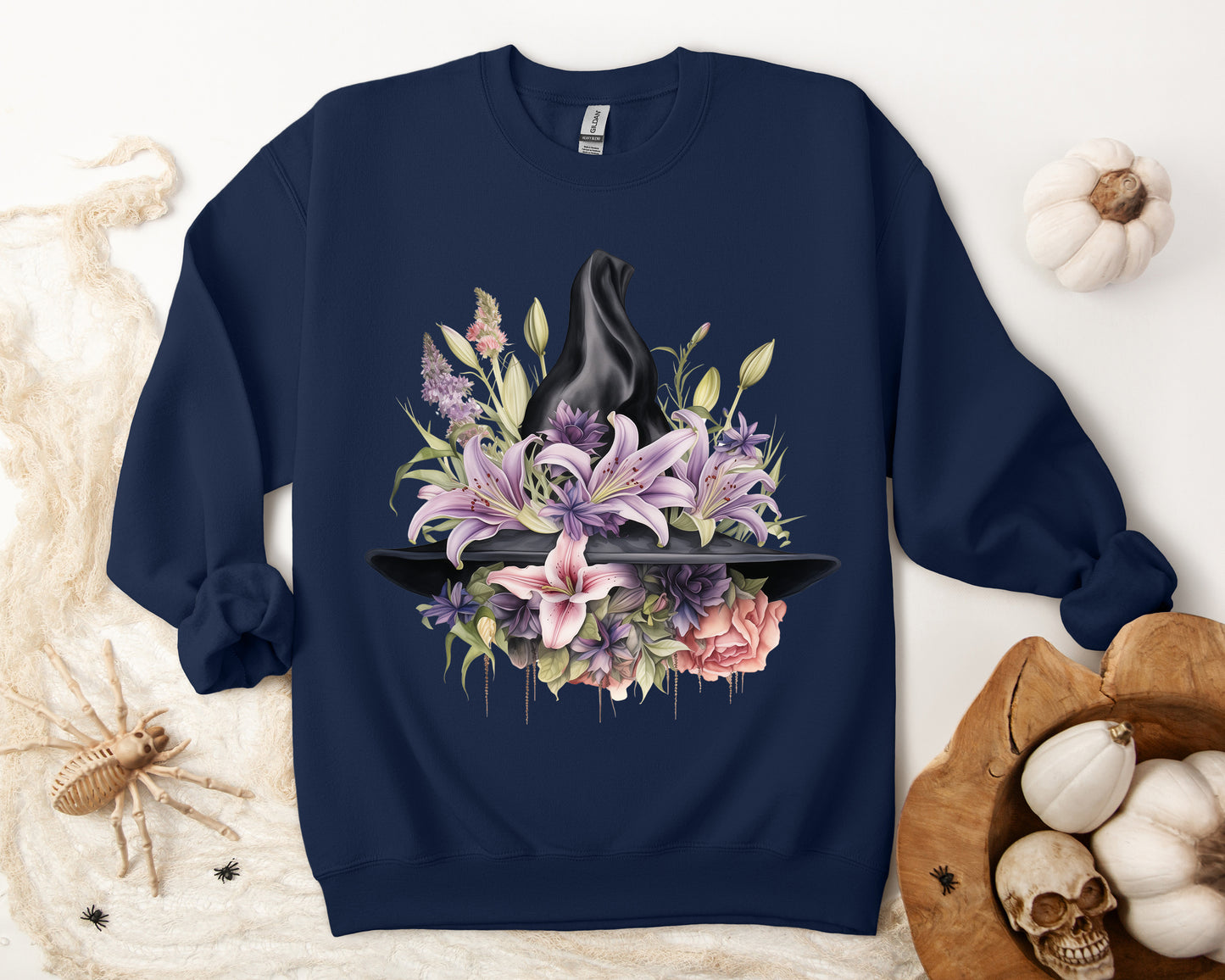 Mystical Floral Witch Hat Sweatshirt featuring a watercolor illustration of a black witch hat with flowers in purple, pink, and green. Available in multiple dark and light colors and sizes. Gildan 18000 sweatshirt in Navy. ReadyShirtAim.com