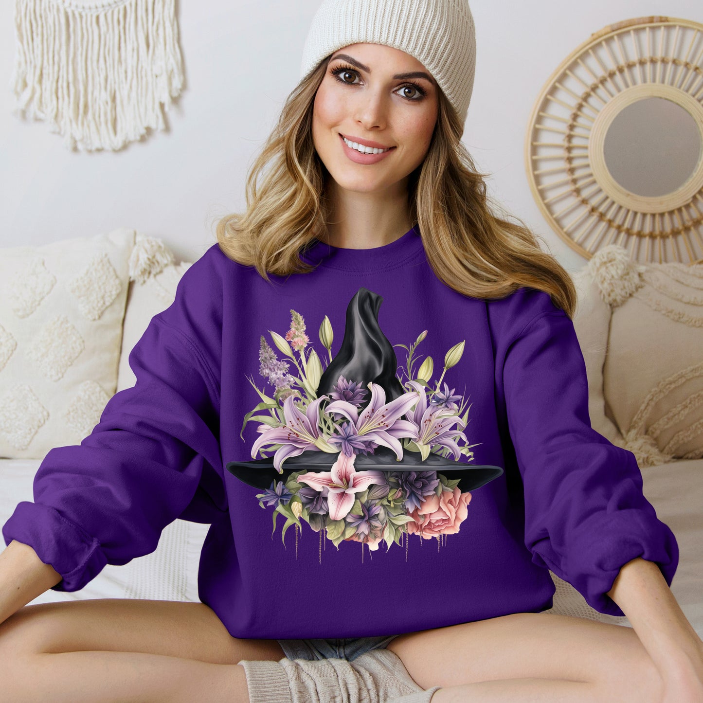 Mystical Floral Witch Hat Sweatshirt featuring a watercolor illustration of a black witch hat with flowers in purple, pink, and green. Available in multiple dark and light colors and sizes. Gildan 18000 sweatshirt in Purple. ReadyShirtAim.com