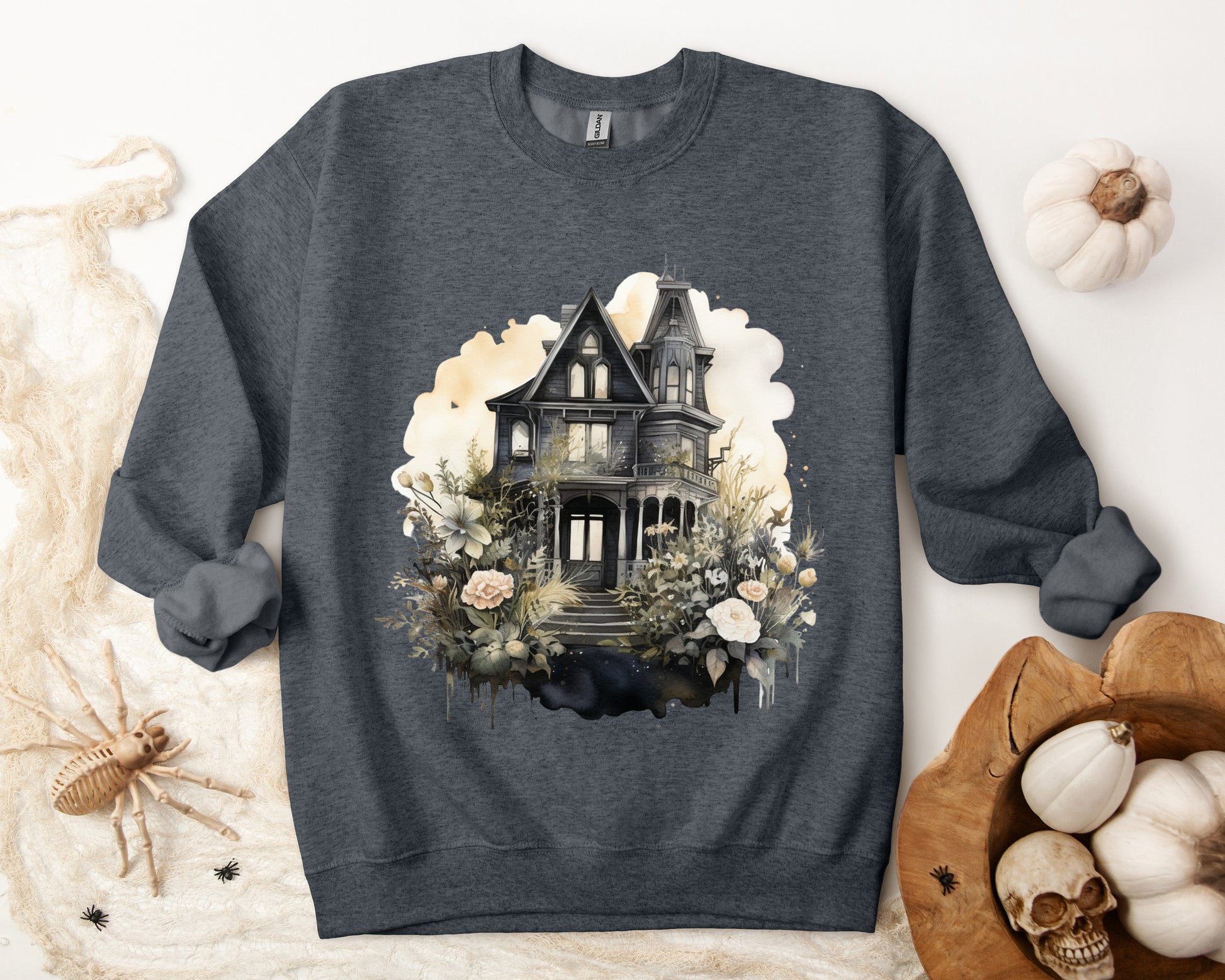 Halloween Boho Sweatshirt for Women featuring a mystical midnight haunted house illustration with boho design accents. Perfect for autumn festivities and casual wear. Available in multiple dark and light colors and sizes. Gildan 18000 sweatshirt in Dark Heather. ReadyShirtAim.com