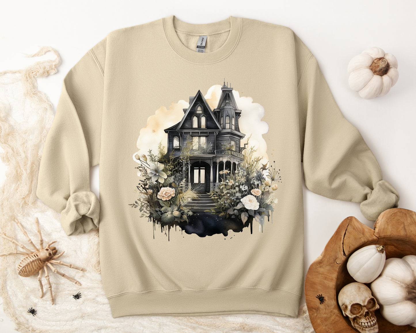 Halloween Boho Sweatshirt for Women featuring a mystical midnight haunted house illustration with boho design accents. Perfect for autumn festivities and casual wear. Gildan 18000 sweatshirt in Sand. ReadyShirtAim.com