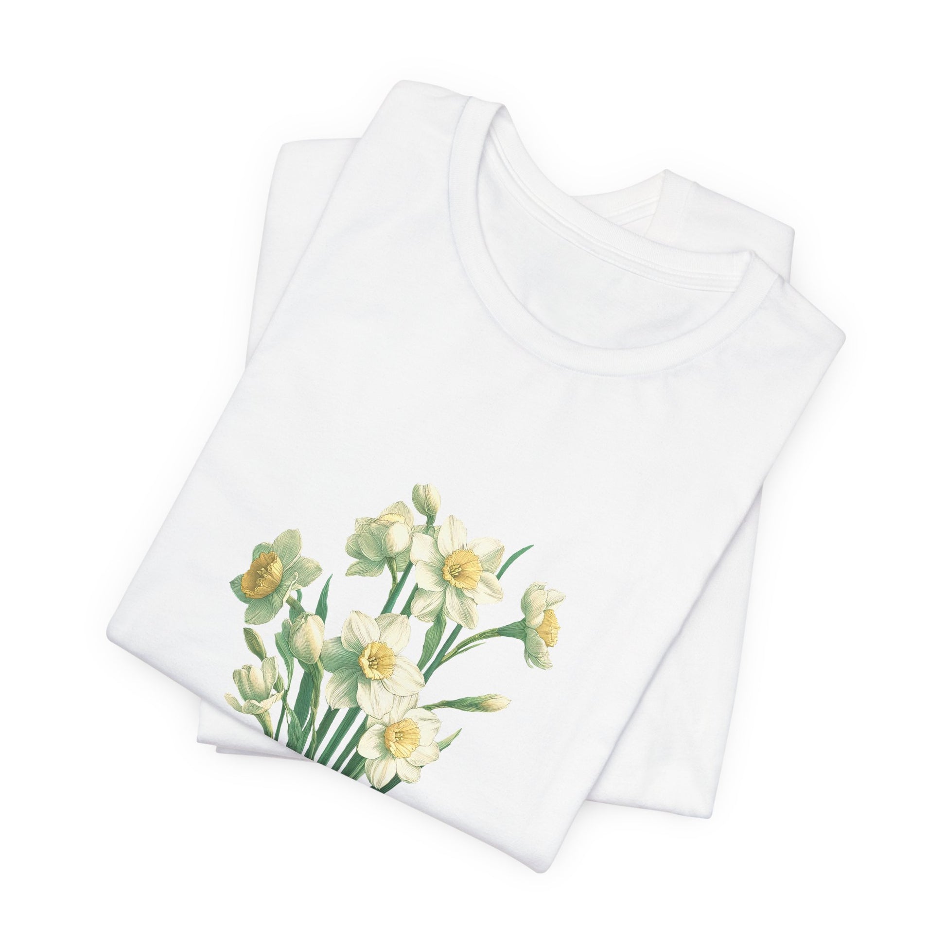 A t-shirt featuring a beautiful narcissus for December. Perfect for December birthdays and floral art lovers. Comfortable and stylish for casual outings or celebrations. Bella+Canvas 3001 t-shirt in white. ReadyShirtAim.com