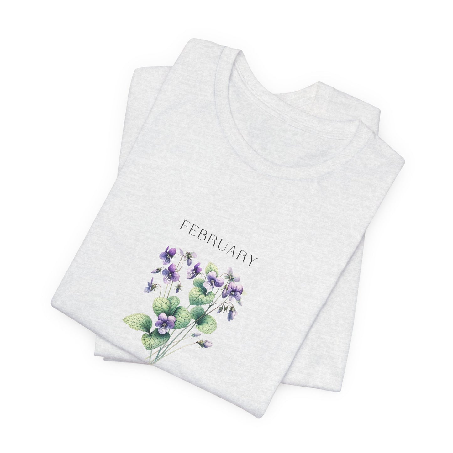 A t-shirt featuring a beautiful violet for February with traits Virtue, Modesty, Humility. Perfect for February birthdays and floral art lovers. Comfortable and stylish for casual outings or celebrations. Bella+Canvas 3001 t-shirt in ash. ReadyShirtAim.com