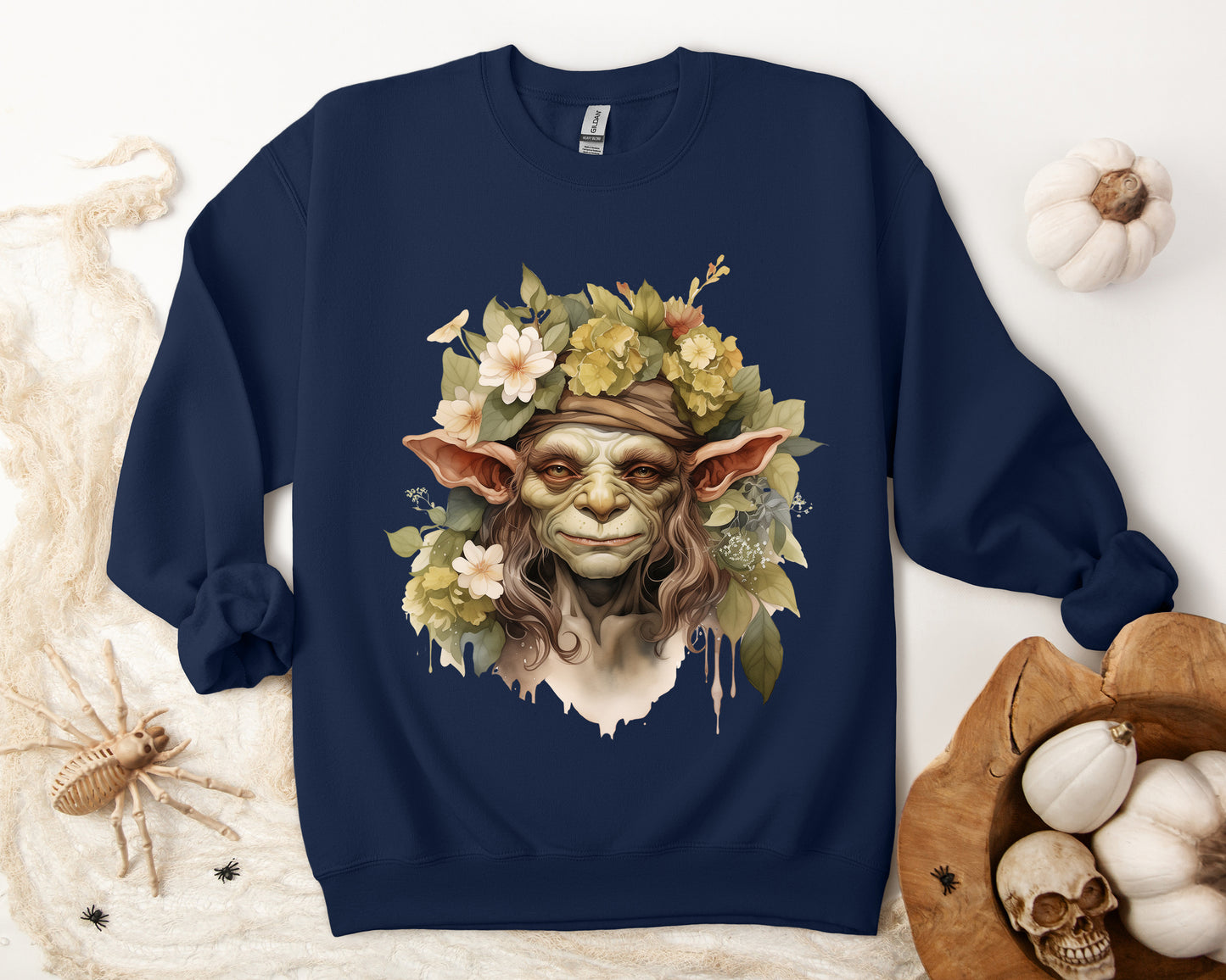 Creepy Cute Goblin Floral Boho Halloween Sweatshirt for women. Features a charming goblin surrounded by muted florals. Perfect for Halloween celebrations. Available in multiple dark and light colors and sizes. Gildan 18000 sweatshirt in Navy. ReadyShirtAim.com