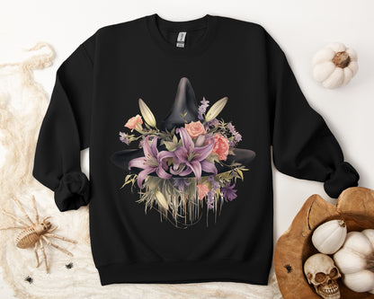 Elegant Witchy Blooms Sweatshirt with a watercolor illustration of a black witch hat and flowers in purple, pink, and green. Available in multiple dark and light colors and sizes. Gildan 18000 sweatshirt in Black. ReadyShirtAim.com