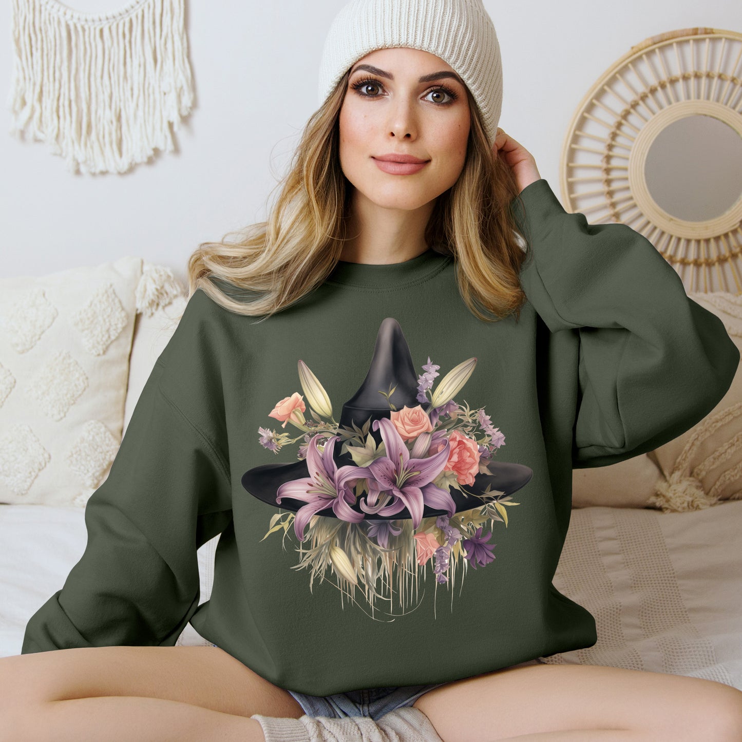 Elegant Witchy Blooms Sweatshirt with a watercolor illustration of a black witch hat and flowers in purple, pink, and green. Available in multiple dark and light colors and sizes. Gildan 18000 sweatshirt in Military Green. ReadyShirtAim.com