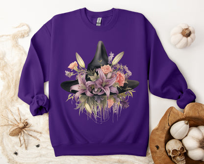 Elegant Witchy Blooms Sweatshirt with a watercolor illustration of a black witch hat and flowers in purple, pink, and green. Available in multiple dark and light colors and sizes. Gildan 18000 sweatshirt in Purple. ReadyShirtAim.com