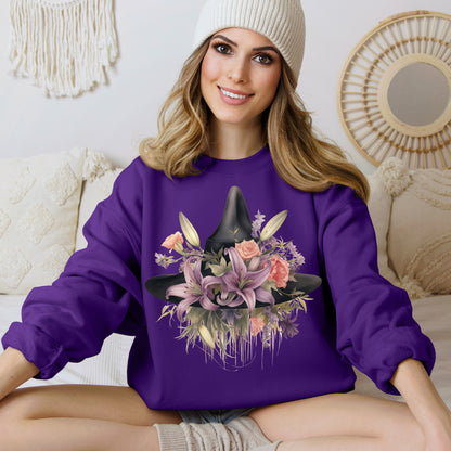 Elegant Witchy Blooms Sweatshirt with a watercolor illustration of a black witch hat and flowers in purple, pink, and green. Available in multiple dark and light colors and sizes. Gildan 18000 sweatshirt in Purple. ReadyShirtAim.com