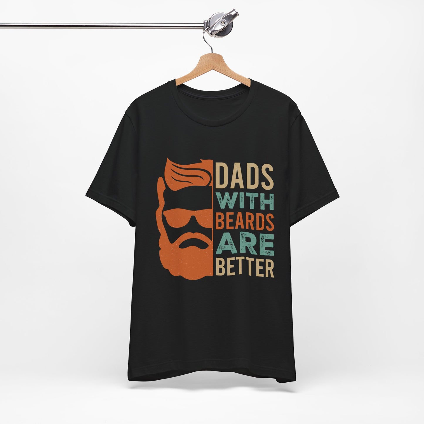 A funny t-shirt with the slogan "Dads With Beards Are Better" in bold letters, perfect for Father's Day or any dad with a beard who loves a good laugh. Available in multiple colors and sizes. Bella+Canvas 3001 t-shirt. ReadyShirtAim.com