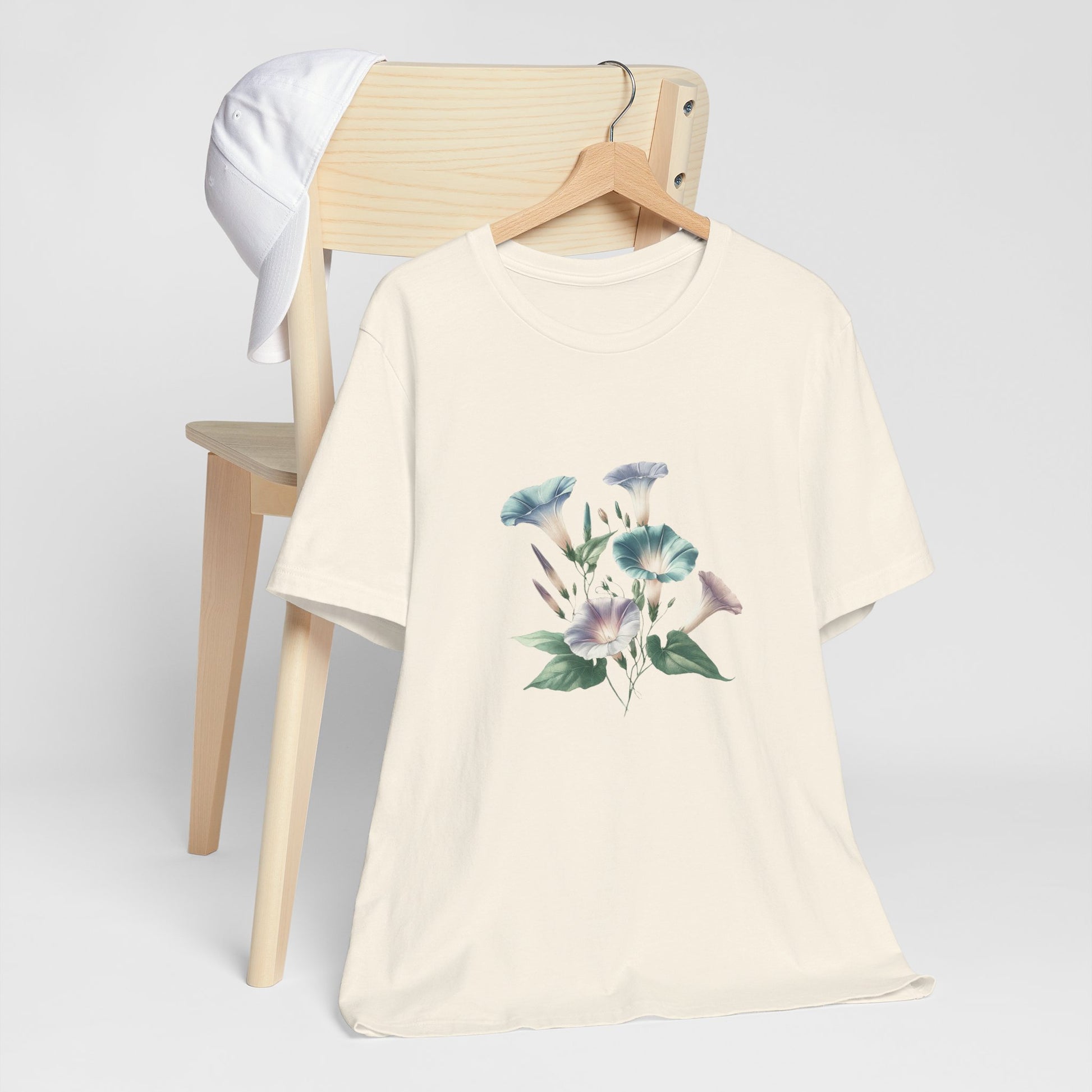 A t-shirt featuring a beautiful morning glory for September. Perfect for September birthdays and floral art lovers. Comfortable and stylish for casual outings or celebrations. Bella+Canvas 3001 t-shirt in natural. ReadyShirtAim.com