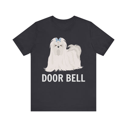 "Door Bell" Maltese Dog T-Shirt for Unisex with a beige silhouette of a Maltese dog and playful "Door Bell" text underneath. Ideal for dog lovers with a sense of humor. Available in multiple colors and sizes. Bella+Canvas 3001 t-shirt in dark grey. ReadyShirtAim.com