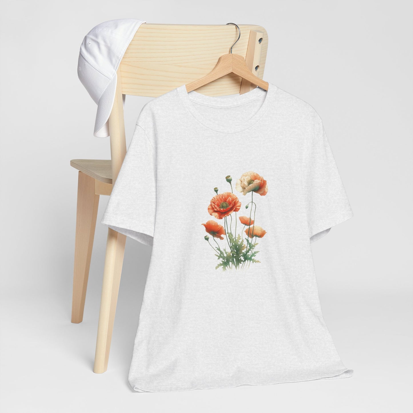 A t-shirt featuring a beautiful poppy for August. Perfect for August birthdays and floral art lovers. Comfortable and stylish for casual outings or celebrations. Bella+Canvas 3001 t-shirt in ash. ReadyShirtAim.com