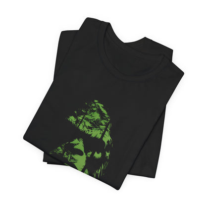 A t-shirt featuring an enigmatic cryptid design of Bigfoot's face, perfect for Bigfoot enthusiasts, cryptid fans, and adventure seekers. Comfortable and stylish for casual outings or cryptid conventions. Bella+Canvas 3001 t-shirt in black. ReadyShirtAim.com