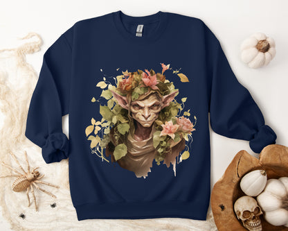 Boho Goblin Magic Halloween Sweatshirt for women. Features a charming goblin surrounded by muted florals. Perfect for Halloween celebrations. Available in multiple dark and light colors and sizes. Gildan 18000 sweatshirt in Navy. ReadyShirtAim.com