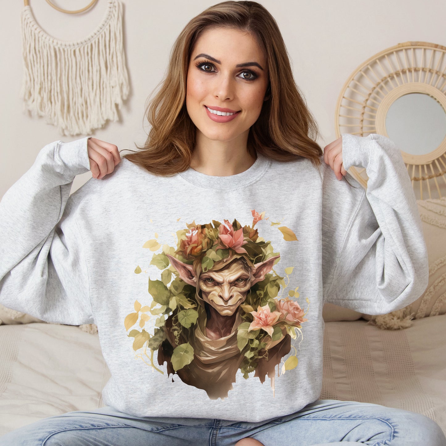 Boho Goblin Magic Halloween Sweatshirt for women. Features a charming goblin surrounded by muted florals. Perfect for Halloween celebrations. Available in multiple dark and light colors and sizes. Gildan 18000 sweatshirt in ash. ReadyShirtAim.com