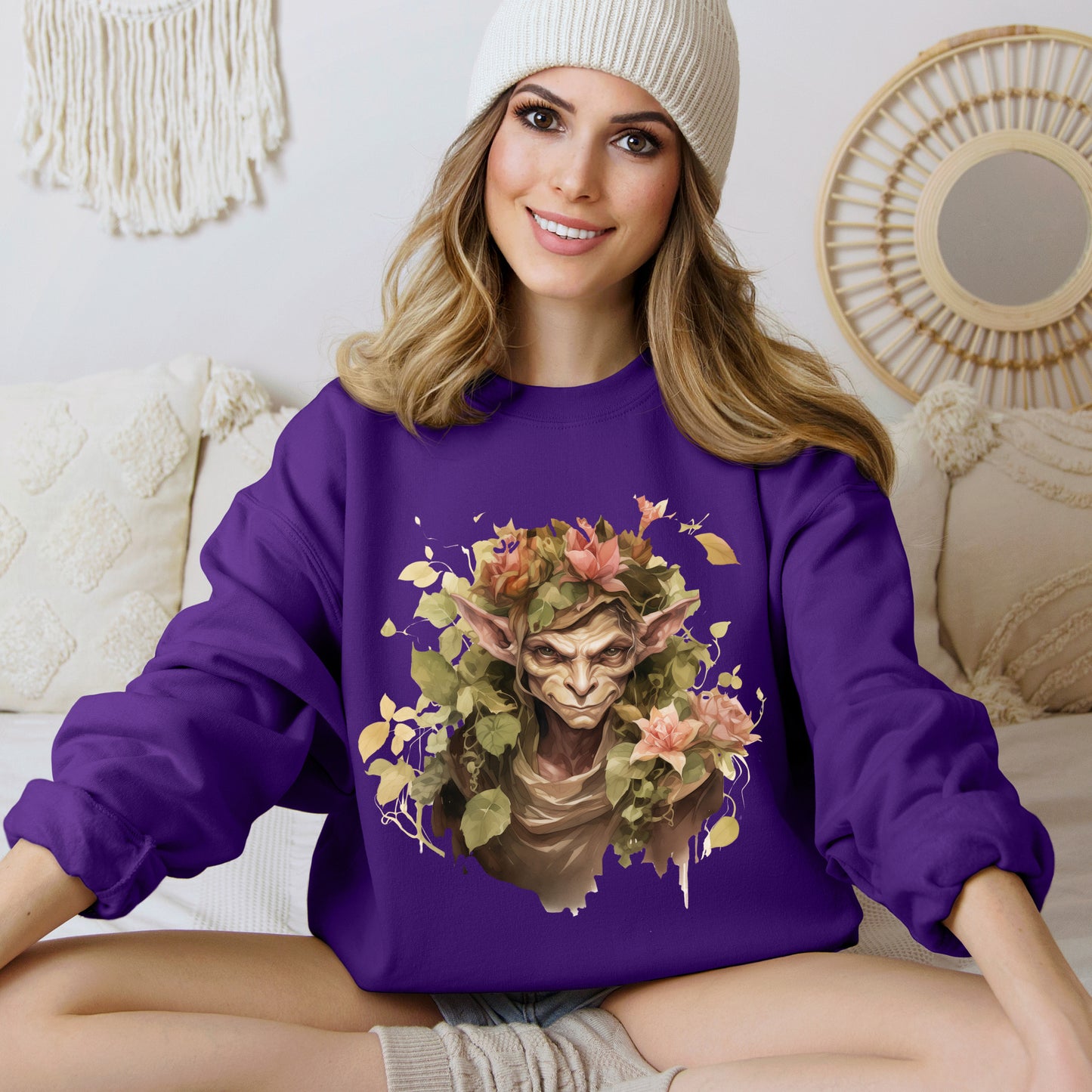 Boho Goblin Magic Halloween Sweatshirt for women. Features a charming goblin surrounded by muted florals. Perfect for Halloween celebrations. Available in multiple dark and light colors and sizes. Gildan 18000 sweatshirt in Purple. ReadyShirtAim.com