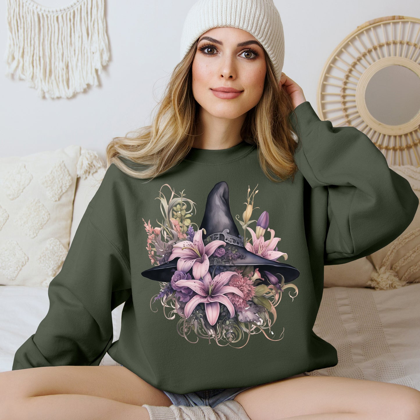 Charming Witch Hat & Flowers Sweatshirt with a watercolor illustration of a black witch hat and flowers in purple, pink, and green. Available in multiple dark and light colors and sizes. Gildan 18000 sweatshirt in Military Green. ReadyShirtAim.com