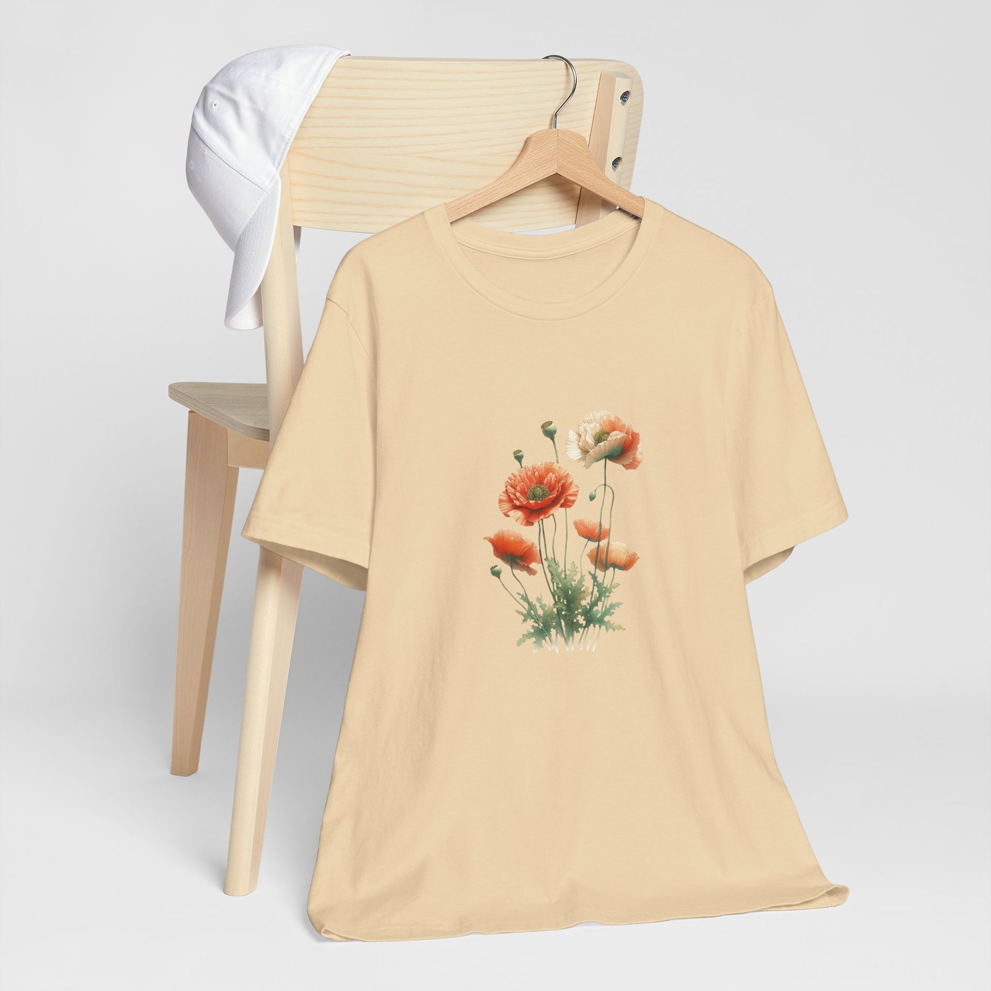 A t-shirt featuring a beautiful poppy for August. Perfect for August birthdays and floral art lovers. Comfortable and stylish for casual outings or celebrations. Bella+Canvas 3001 t-shirt in soft cream. ReadyShirtAim.com