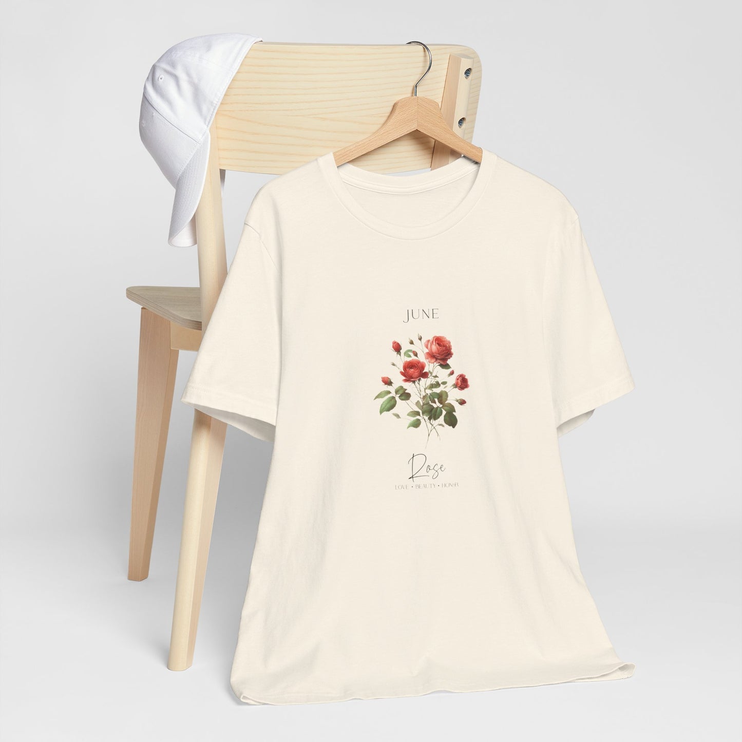 A t-shirt featuring a beautiful rose for June with traits Love, Beauty, Honor. Perfect for June birthdays and floral art lovers. Comfortable and stylish for casual outings or celebrations. Bella+Canvas 3001 t-shirt in natural. ReadyShirtAim.com