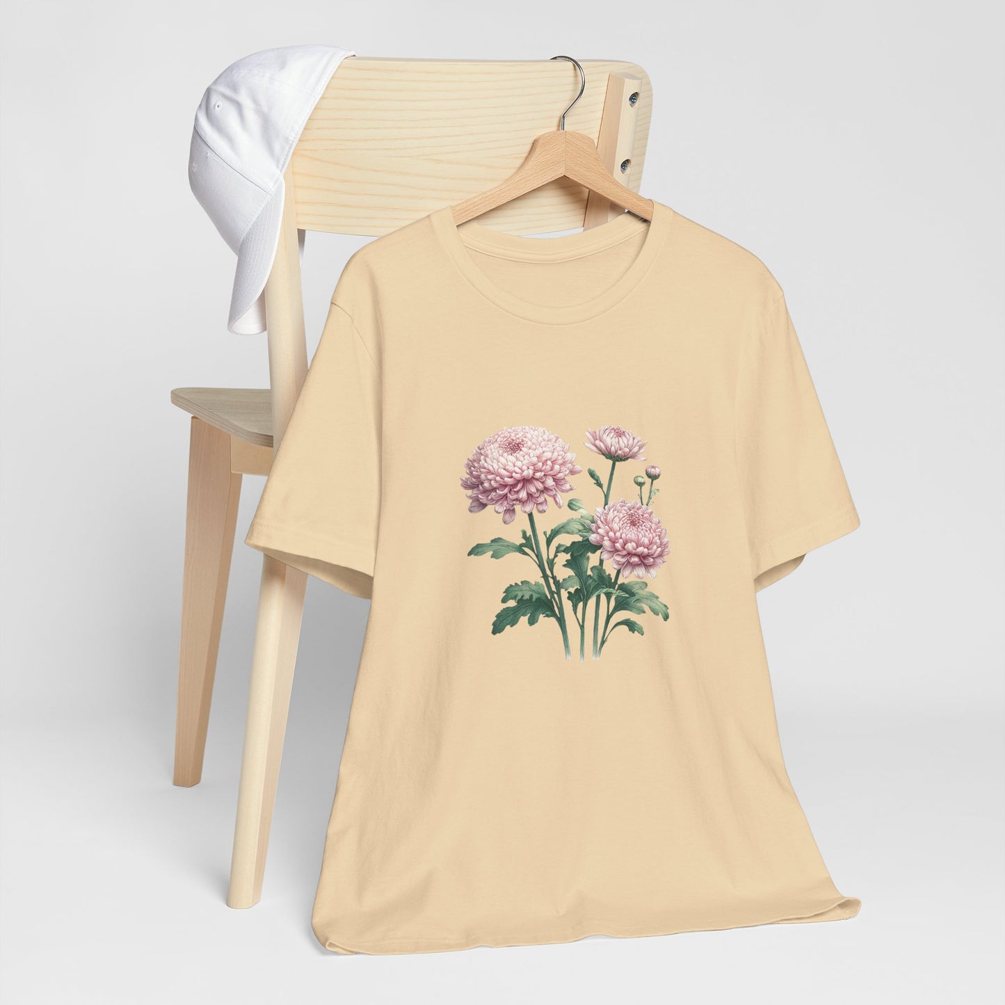 A t-shirt featuring a beautiful chrysanthemum for November. Perfect for November birthdays and floral art lovers. Comfortable and stylish for casual outings or celebrations. Bella+Canvas 3001 t-shirt in soft cream. ReadyShirtAim.com