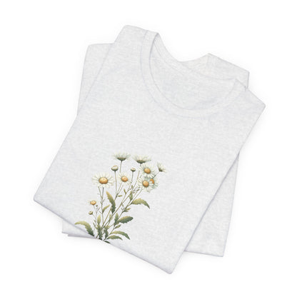 A t-shirt featuring a beautiful daisy for April. Perfect for April birthdays and floral art lovers. Comfortable and stylish for casual outings or celebrations. Bella+Canvas 3001 t-shirt in ash. ReadyShirtAim.com