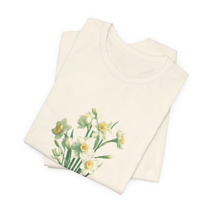 A t-shirt featuring a beautiful narcissus for December. Perfect for December birthdays and floral art lovers. Comfortable and stylish for casual outings or celebrations. Bella+Canvas 3001 t-shirt in natural. ReadyShirtAim.com