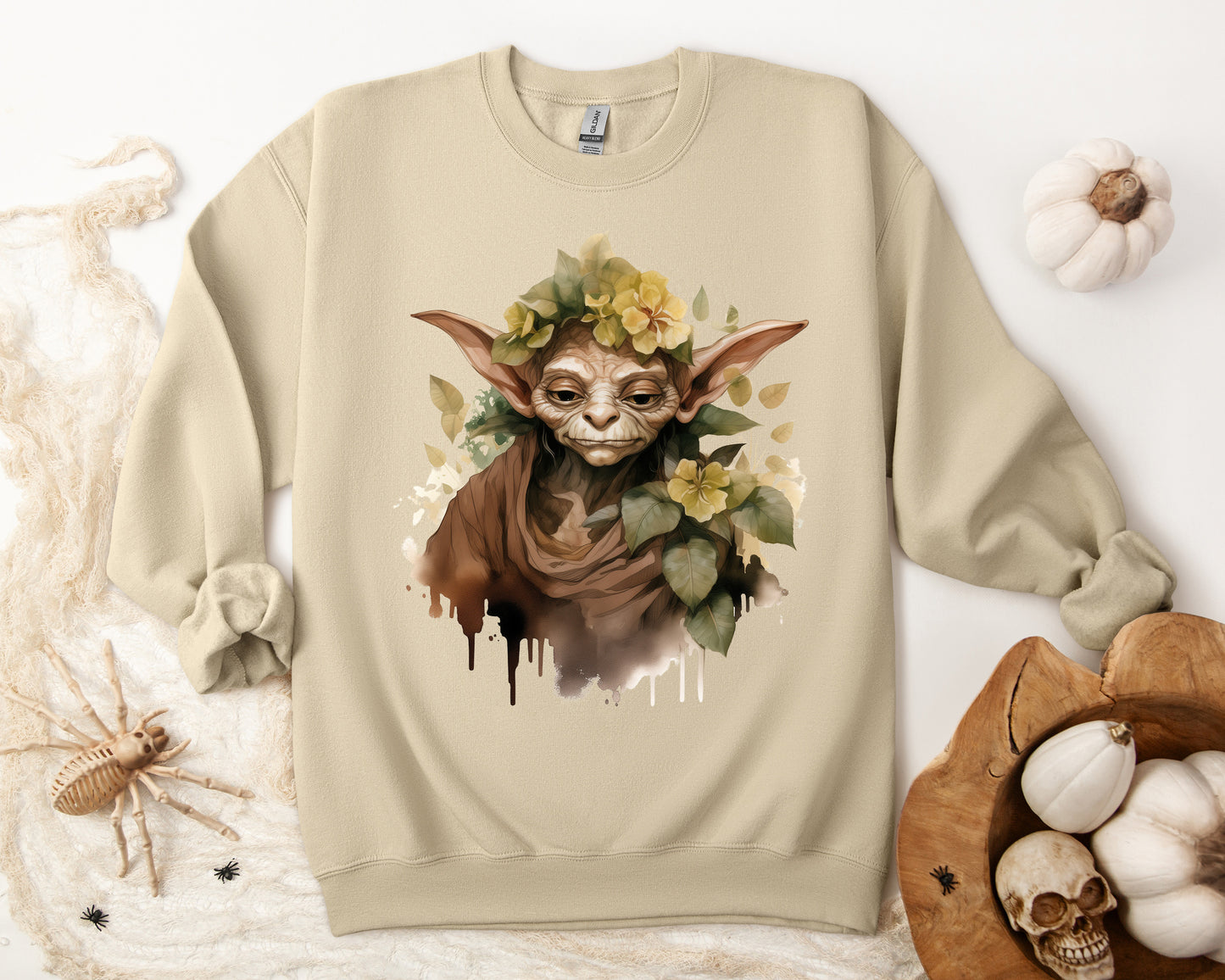 Mystical Goblin Boho Halloween Sweatshirt with a hand-drawn goblin illustration and boho-inspired design elements. Perfect for Halloween celebrations. Gildan 18000 sweatshirt in Sand. ReadyShirtAim.com