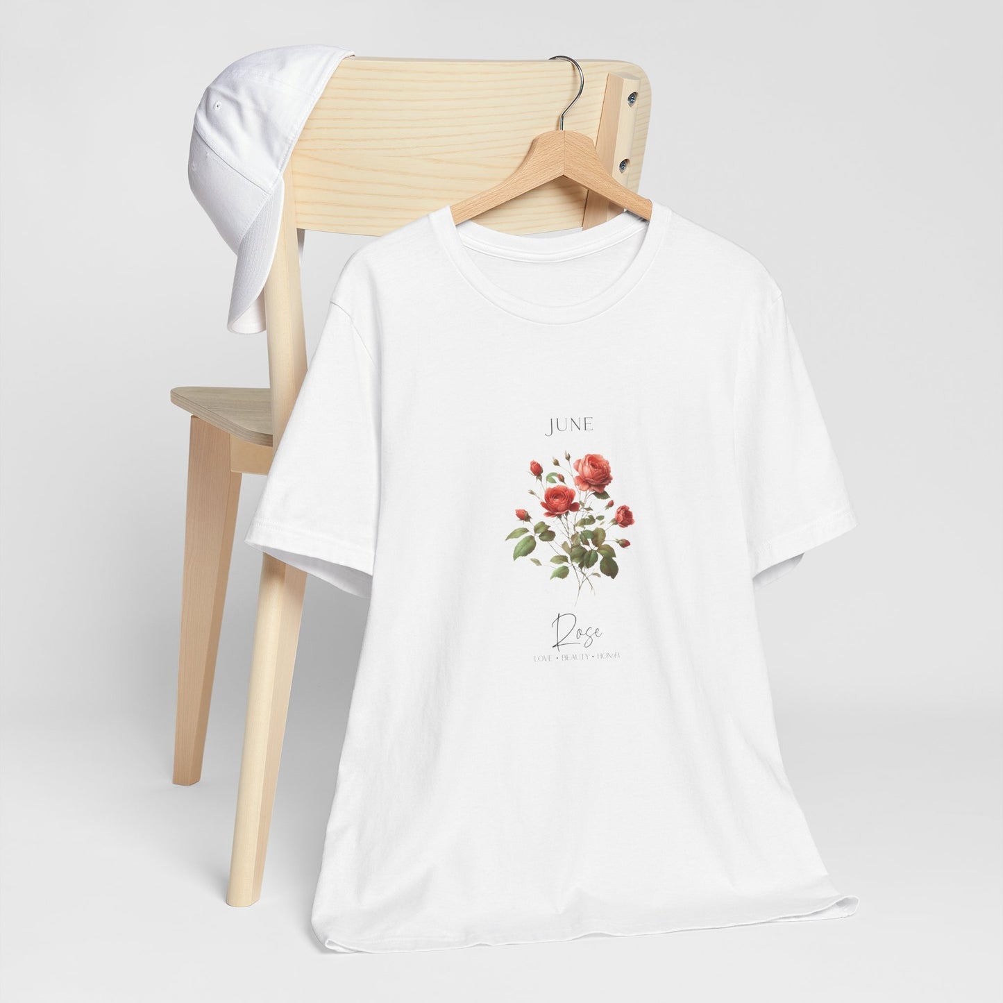 A t-shirt featuring a beautiful rose for June with traits Love, Beauty, Honor. Perfect for June birthdays and floral art lovers. Comfortable and stylish for casual outings or celebrations. Bella+Canvas 3001 t-shirt in white. ReadyShirtAim.com