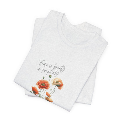 A t-shirt featuring a beautiful poppy for August with the quote “There is beauty in simplicity.” Perfect for August birthdays and floral art lovers. Comfortable and stylish for casual outings or celebrations. Bella+Canvas 3001 t-shirt in ash. ReadyShirtAim.com