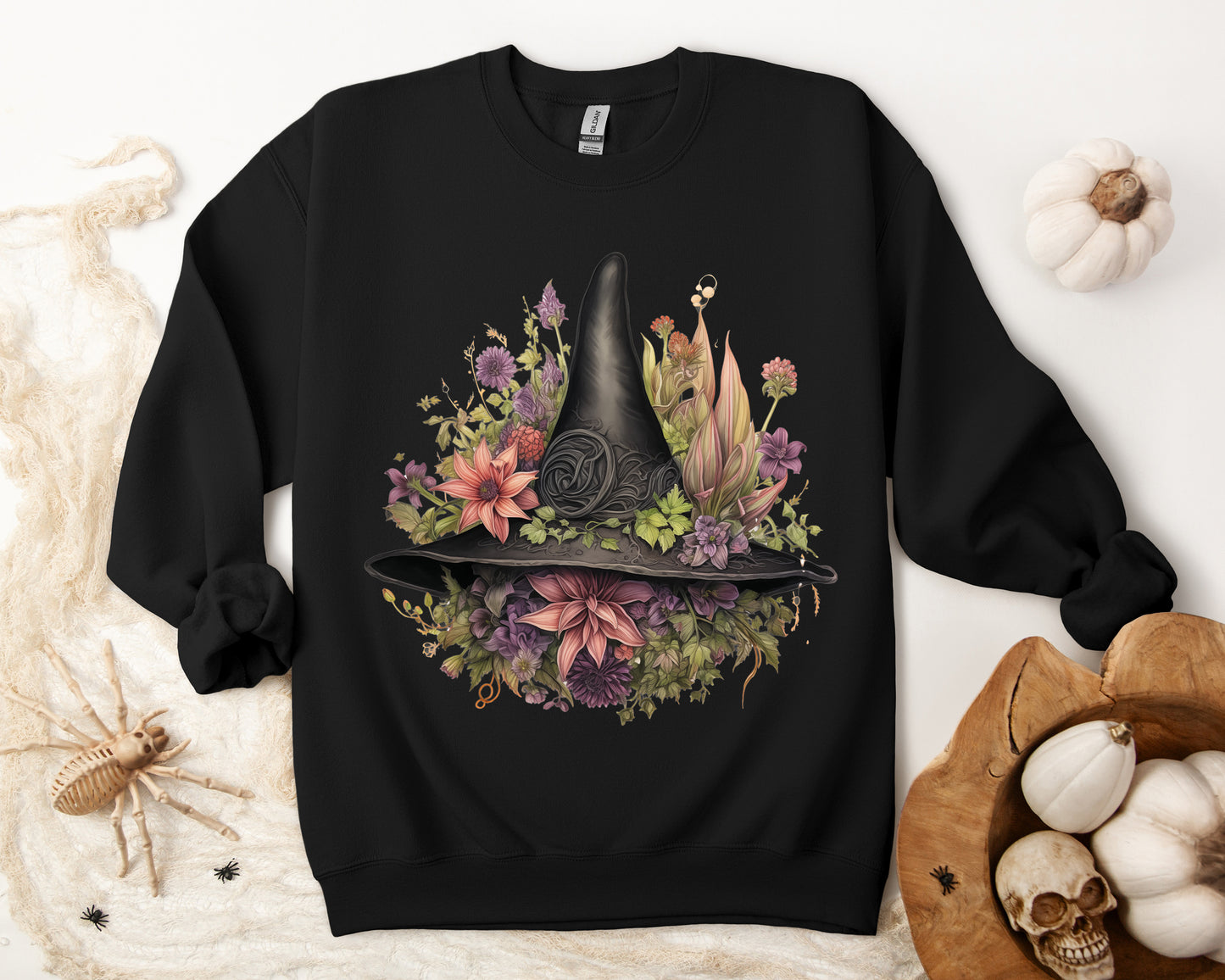 Gothic Boho Witch Hat & Flowers Halloween Sweatshirt for Women with a detailed witch hat and floral illustration. Perfect for Halloween celebrations. Available in multiple dark and light colors and sizes. Gildan 18000 sweatshirt in Black. ReadyShirtAim.com