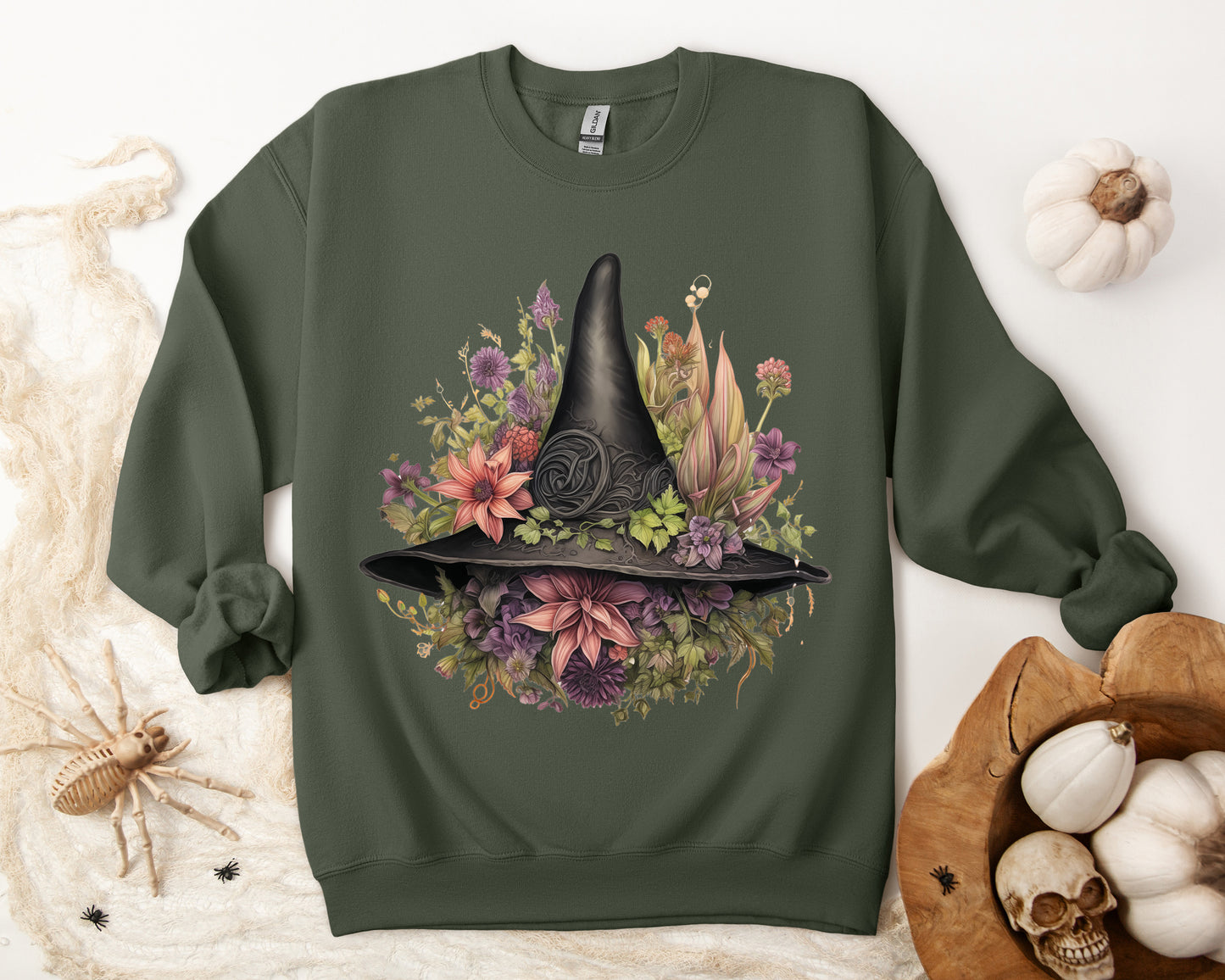 Gothic Boho Witch Hat & Flowers Halloween Sweatshirt for Women with a detailed witch hat and floral illustration. Perfect for Halloween celebrations. Available in multiple dark and light colors and sizes. Gildan 18000 sweatshirt in Military Green. ReadyShirtAim.com