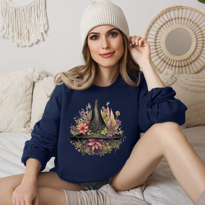 Gothic Boho Witch Hat & Flowers Halloween Sweatshirt for Women with a detailed witch hat and floral illustration. Perfect for Halloween celebrations. Available in multiple dark and light colors and sizes. Gildan 18000 sweatshirt in Navy. ReadyShirtAim.com