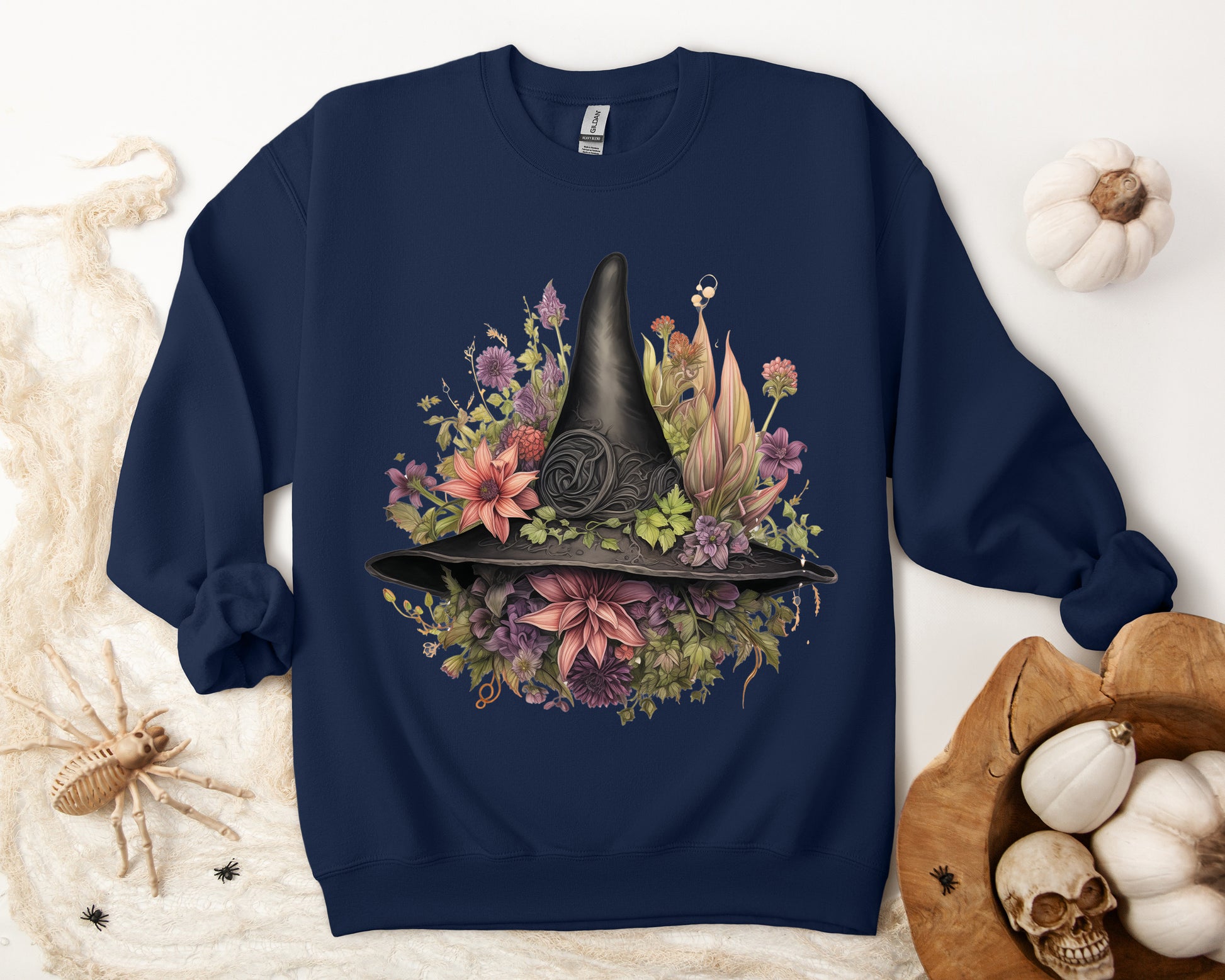 Gothic Boho Witch Hat & Flowers Halloween Sweatshirt for Women with a detailed witch hat and floral illustration. Perfect for Halloween celebrations. Available in multiple dark and light colors and sizes. Gildan 18000 sweatshirt in Navy. ReadyShirtAim.com