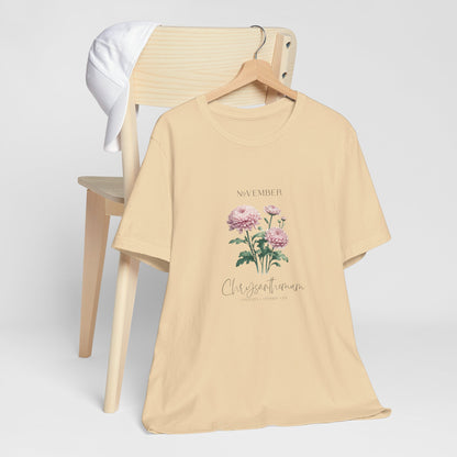 A t-shirt featuring a beautiful chrysanthemum for November with traits Longevity, Optimism, Joy. Perfect for November birthdays and floral art lovers. Comfortable and stylish for casual outings or celebrations. Bella+Canvas 3001 t-shirt in soft cream. ReadyShirtAim.com