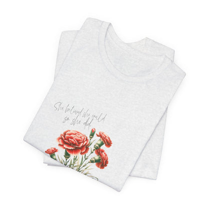 A t-shirt featuring a beautiful carnation for January with the quote “She believed she could, so she did.” Perfect for January birthdays and floral art lovers. Comfortable and stylish for casual outings or celebrations. Bella+Canvas 3001 t-shirt in ash. ReadyShirtAim.com