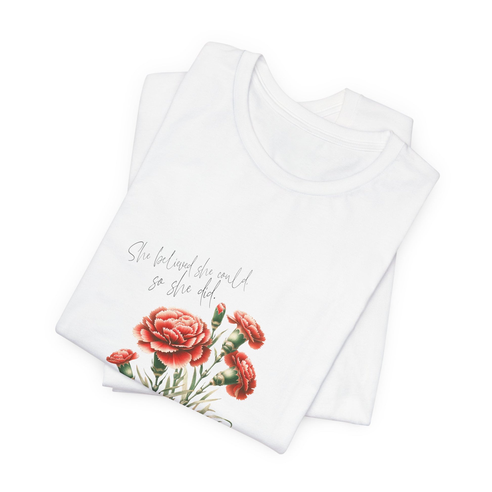 A t-shirt featuring a beautiful carnation for January with the quote “She believed she could, so she did.” Perfect for January birthdays and floral art lovers. Comfortable and stylish for casual outings or celebrations. Bella+Canvas 3001 t-shirt in white. ReadyShirtAim.com