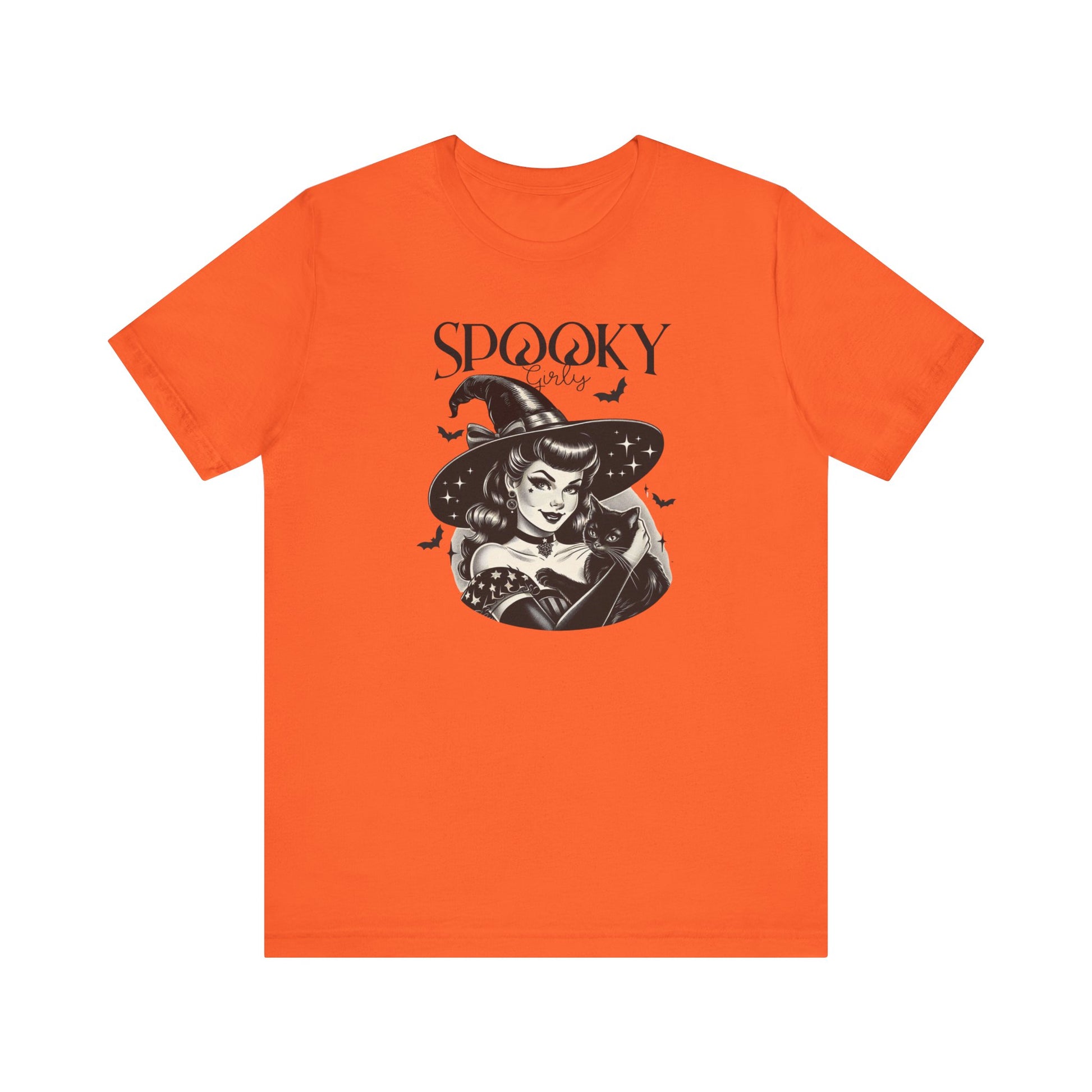 "Spooky Girly" Vintage 1950's Witch Halloween Women's T-Shirt featuring bold black text and a classic black-and-white image of a pin-up girl in a sexy witch costume, holding a black cat and smiling mischievously, perfect for adding a retro touch with playful charm to your Halloween festivities. Available in multiple colors and sizes.  Bella+Canvas 3001 t-shirt in orange. ReadyShirtAim.com