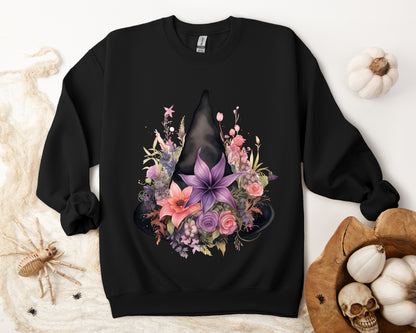 Feminine Witchy Vibes Boho Halloween Sweatshirt for her, featuring a watercolor illustration of a black witch hat and flowers in purple, pink, and green. Available in multiple dark and light colors and sizes. Gildan 18000 sweatshirt in Black. ReadyShirtAim.com