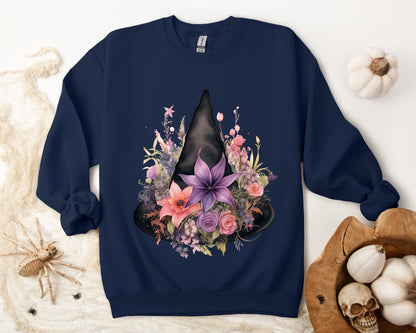 Feminine Witchy Vibes Boho Halloween Sweatshirt for her, featuring a watercolor illustration of a black witch hat and flowers in purple, pink, and green. Available in multiple dark and light colors and sizes. Gildan 18000 sweatshirt in Navy. ReadyShirtAim.com