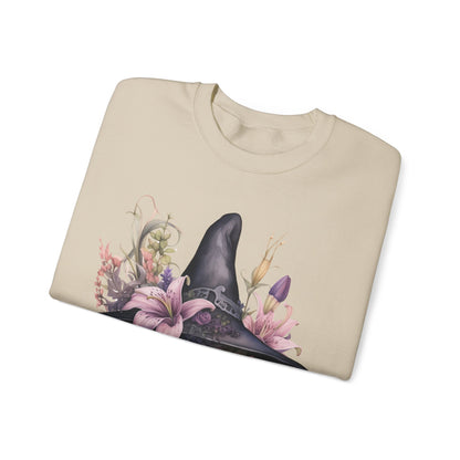 Charming Witch Hat & Flowers Sweatshirt with a watercolor illustration of a black witch hat and flowers in purple, pink, and green. Available in multiple dark and light colors and sizes. Gildan 18000 sweatshirt in Sand. ReadyShirtAim.com