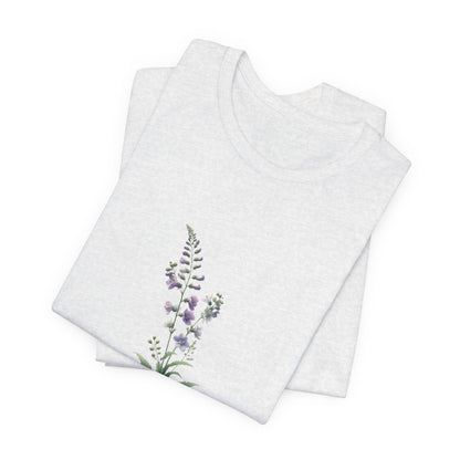 A t-shirt featuring a beautiful larkspur for July. Perfect for July birthdays and floral art lovers. Comfortable and stylish for casual outings or celebrations. Bella+Canvas 3001 t-shirt in ash. ReadyShirtAim.com