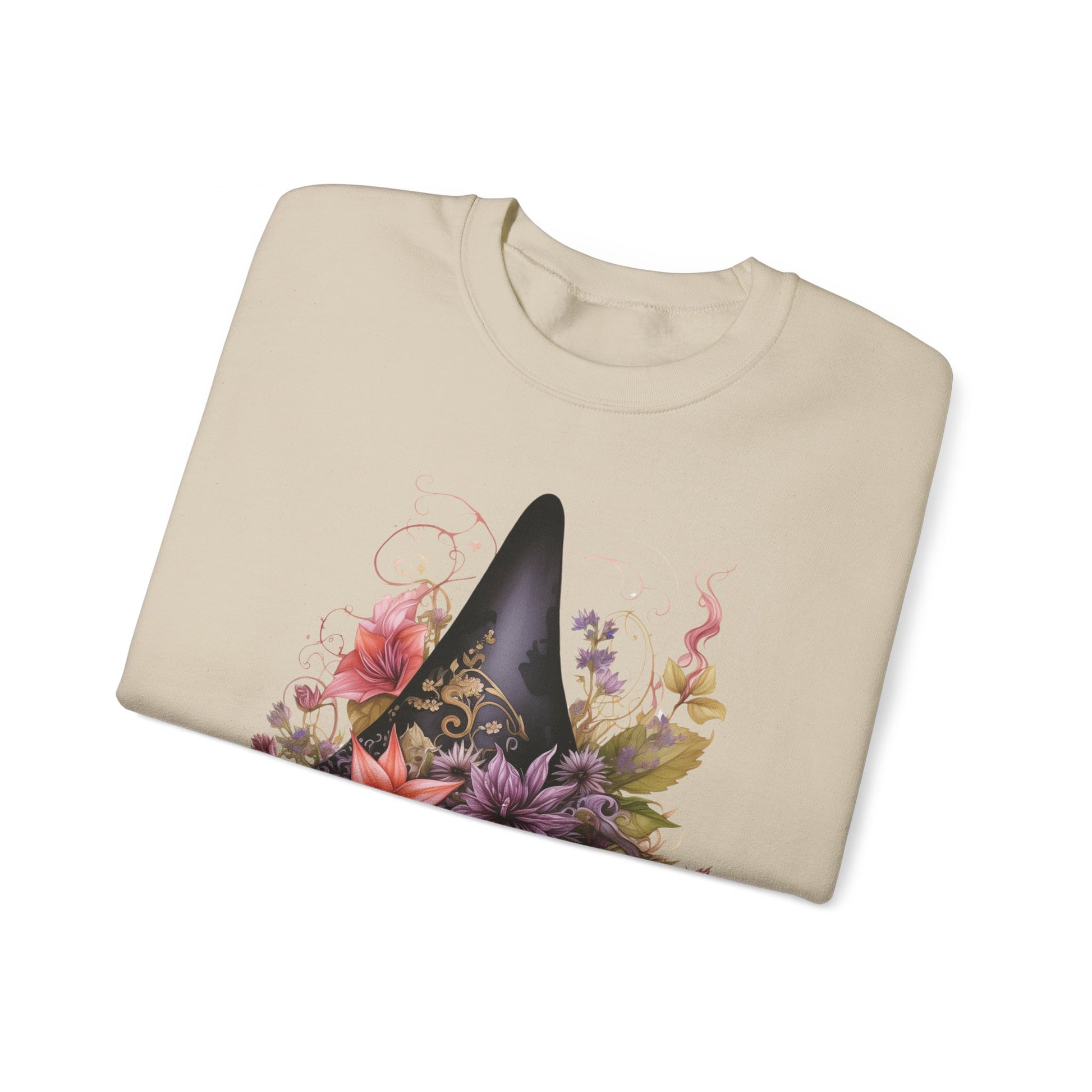 Whimsical Witch Hat Sweatshirt with a watercolor illustration of a black witch hat surrounded by flowers in purple, pink, and green. Available in multiple dark and light colors and sizes. Gildan 18000 sweatshirt in Sand. ReadyShirtAim.com