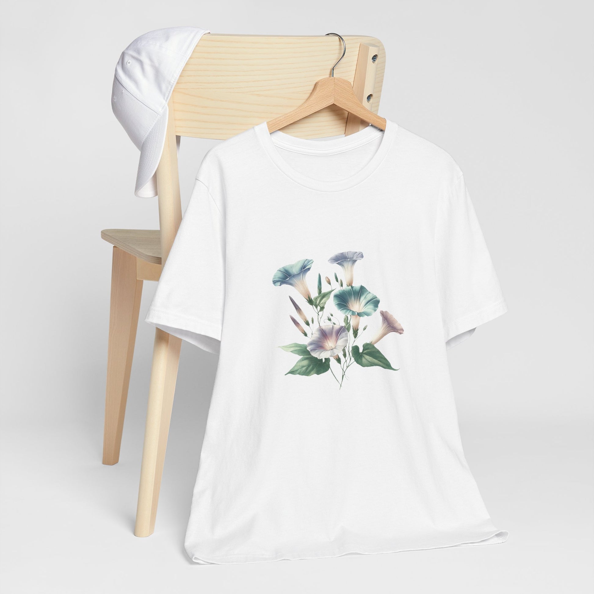 A t-shirt featuring a beautiful morning glory for September. Perfect for September birthdays and floral art lovers. Comfortable and stylish for casual outings or celebrations. Bella+Canvas 3001 t-shirt in white. ReadyShirtAim.com