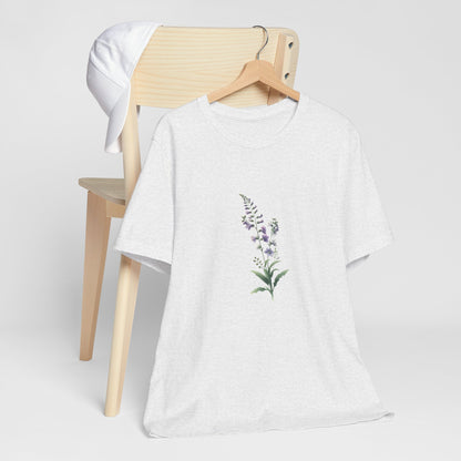 A t-shirt featuring a beautiful larkspur for July. Perfect for July birthdays and floral art lovers. Comfortable and stylish for casual outings or celebrations. Bella+Canvas 3001 t-shirt in ash. ReadyShirtAim.com