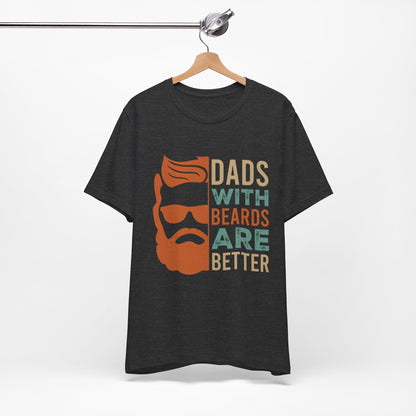 A funny t-shirt with the slogan "Dads With Beards Are Better" in bold letters, perfect for Father's Day or any dad with a beard who loves a good laugh. Available in multiple colors and sizes. Bella+Canvas 3001 t-shirt. ReadyShirtAim.com