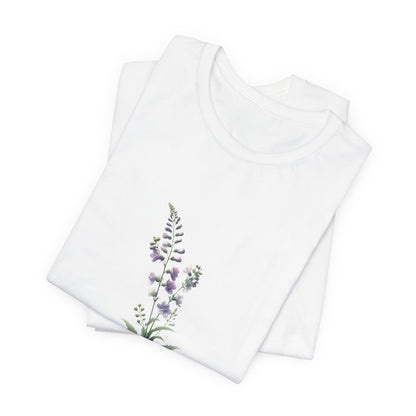 A t-shirt featuring a beautiful larkspur for July. Perfect for July birthdays and floral art lovers. Comfortable and stylish for casual outings or celebrations.Bella+Canvas 3001 t-shirt in white. ReadyShirtAim.com