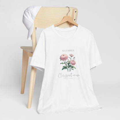 A t-shirt featuring a beautiful chrysanthemum for November with traits Longevity, Optimism, Joy. Perfect for November birthdays and floral art lovers. Comfortable and stylish for casual outings or celebrations. Bella+Canvas 3001 t-shirt in white. ReadyShirtAim.com