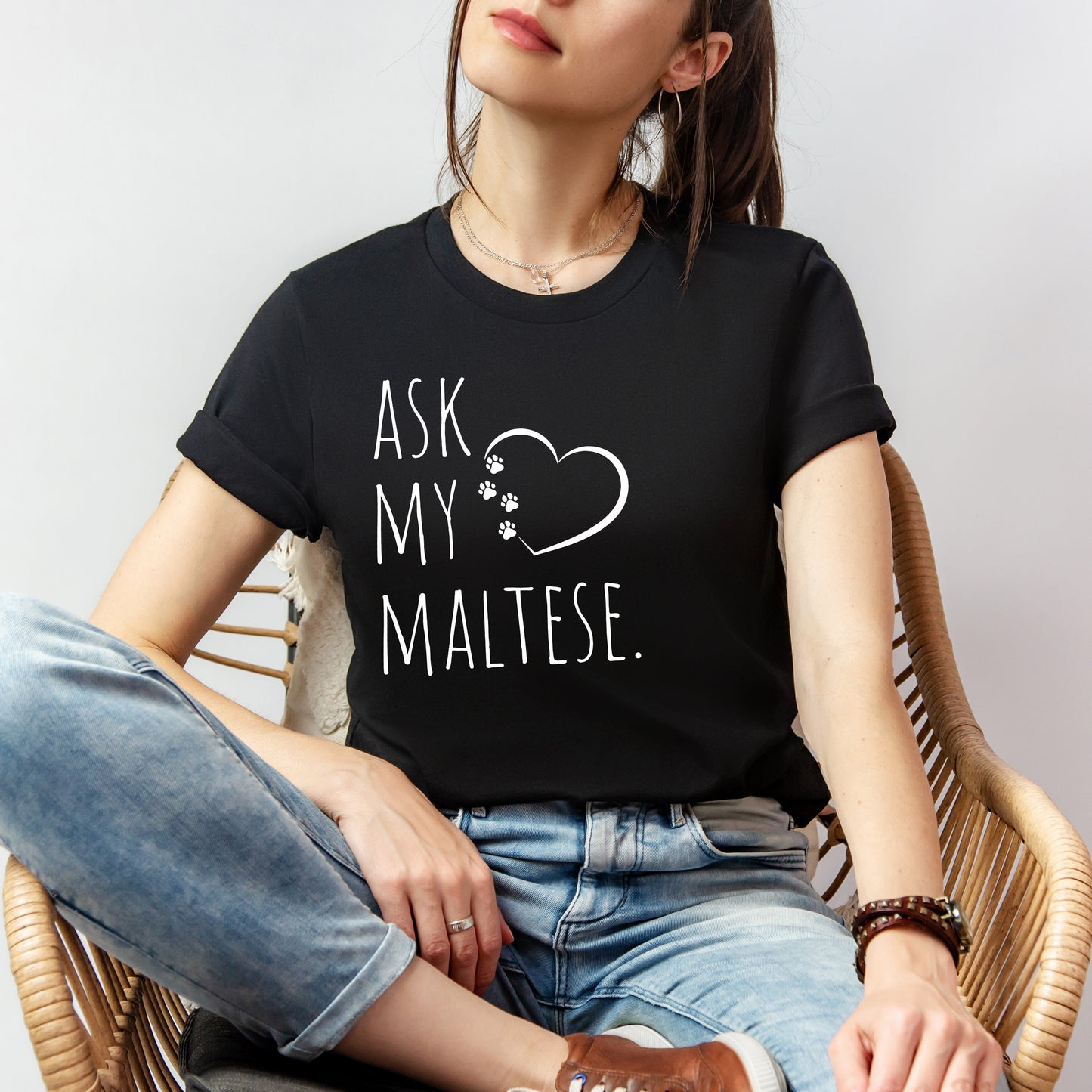 "Ask My Maltese" T-Shirt featuring a heart with two paw prints, perfect for dog lovers and Maltese owners. Unisex design for men and women. Available in multiple colors and sizes. Bella+Canvas 3001 t-shirt in black. ReadyShirtAim.com